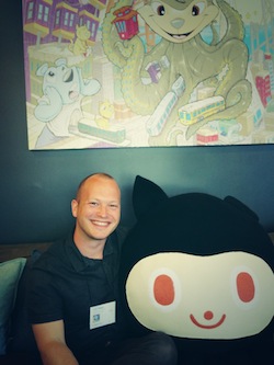 Fig. 4: Cuddling on the GitHub HQ 2.0 couch with the Octocat.